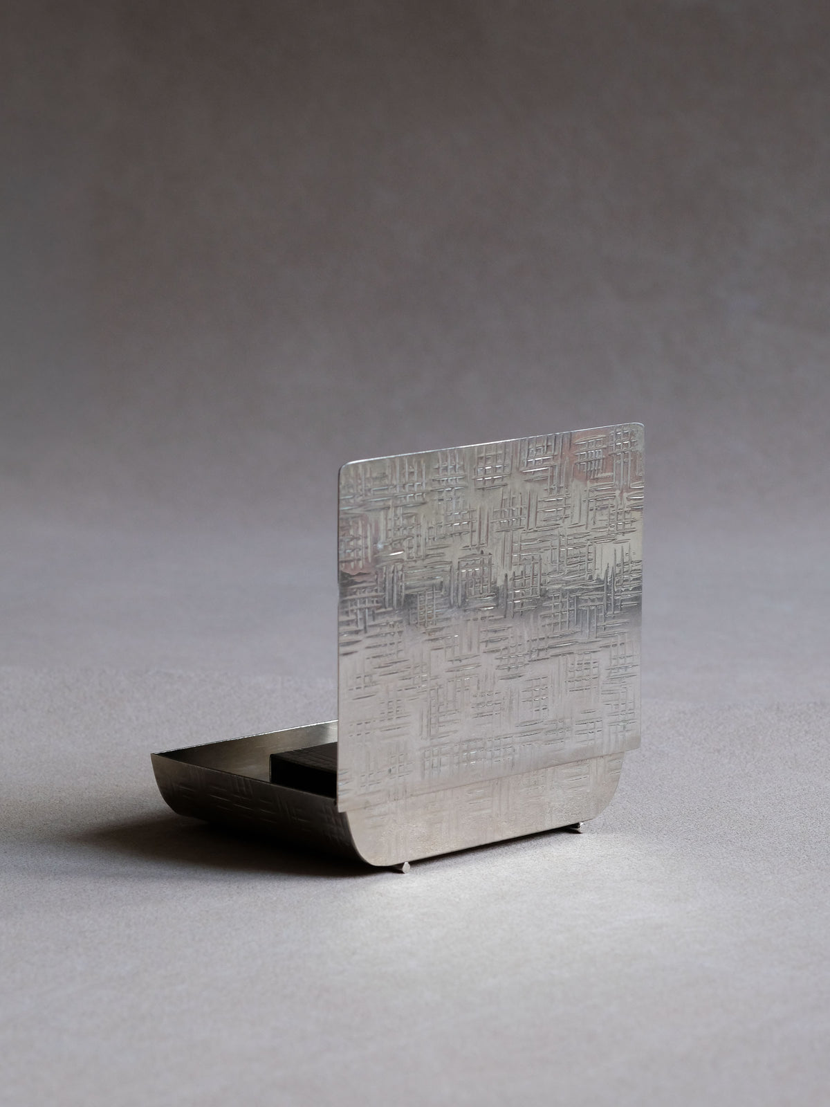 Art Deco silver-plated table matchbox with the fitted lid open, showing the original inner match tray.