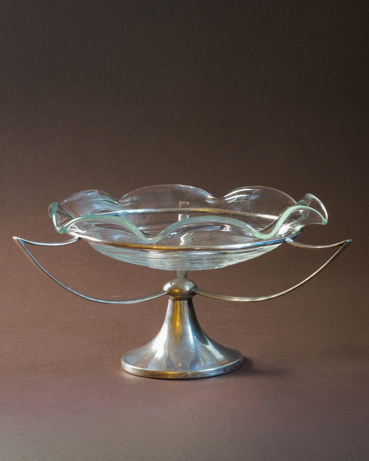 Base detail of the Art Deco tazza showing the EPNS silver-plated metal construction.