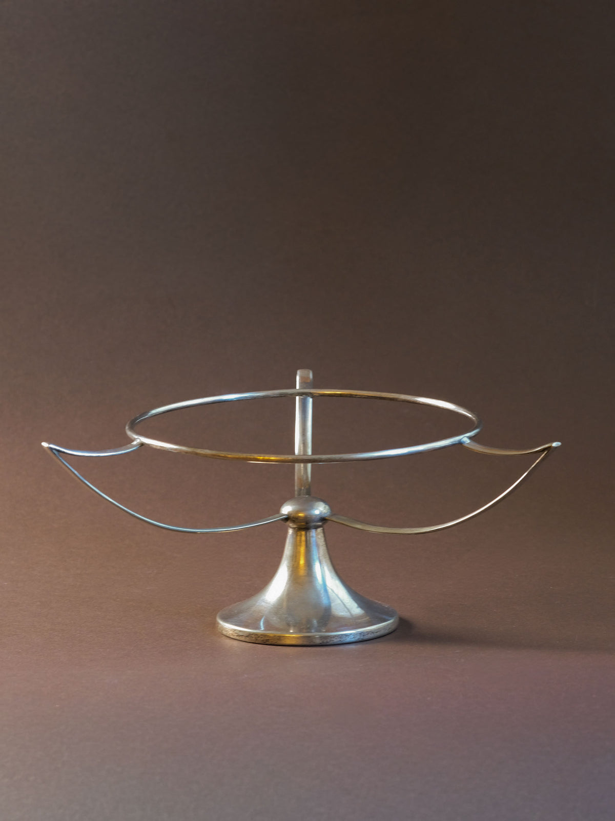 Additional detail view of the Art Deco EPNS and clear glass tazza bowl with its open three-arm structure.