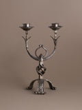Full frontal view of hand-forged wrought iron two-arm candleholder, 1960s Europe.
