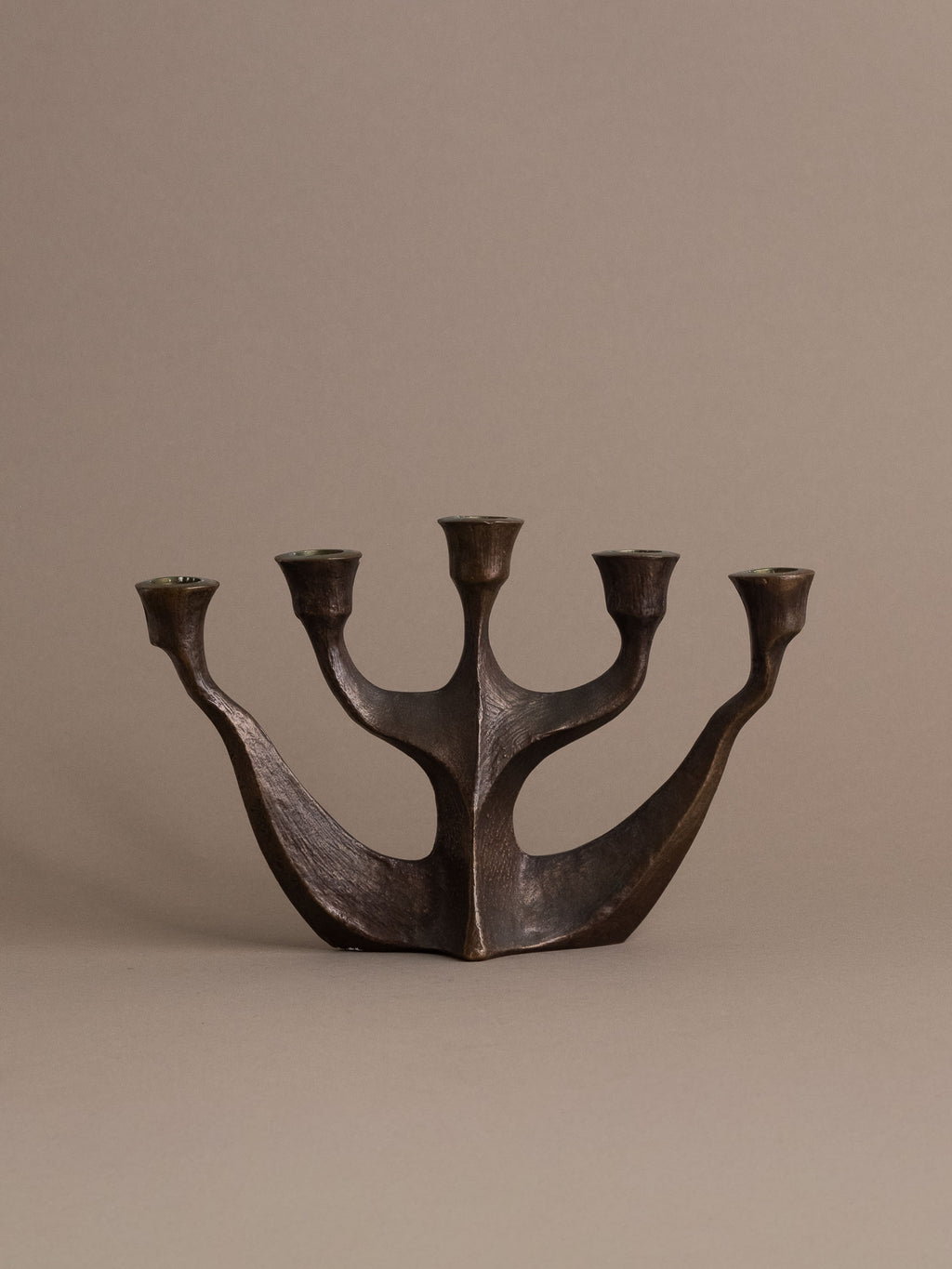 Front view of Brutalist five-arm bronze candleholder, Germany, 1960s–70s.
