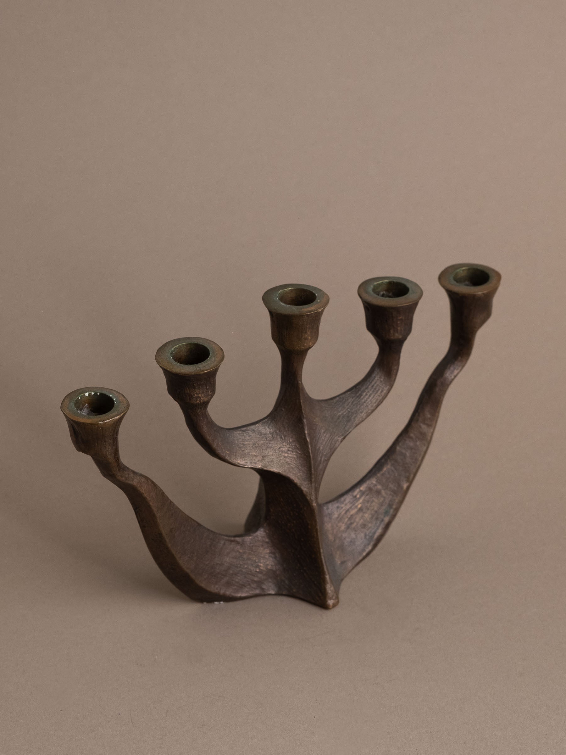 Angled view of Brutalist five-arm bronze candleholder, Germany, 1960s–70s.