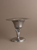 Front view of Dahlströms Tenn pewter pedestal bowl with stylised sea lion stem, Sweden, c. 1930s.