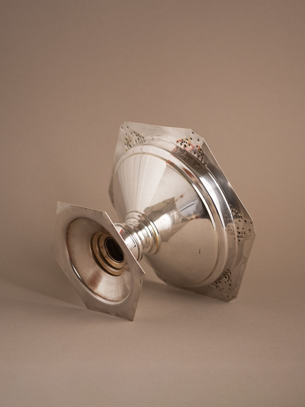 Underside view of the silver-plated pedestal bowl showing the hollow foot and base.