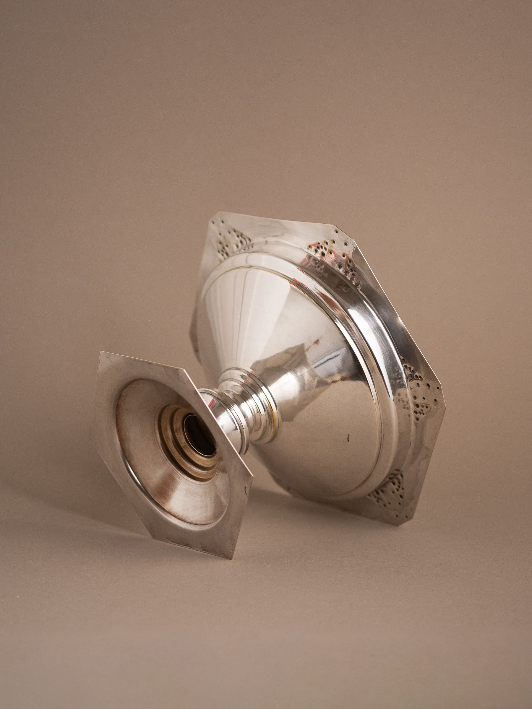 Underside view of the silver-plated pedestal bowl showing the hollow foot and base.