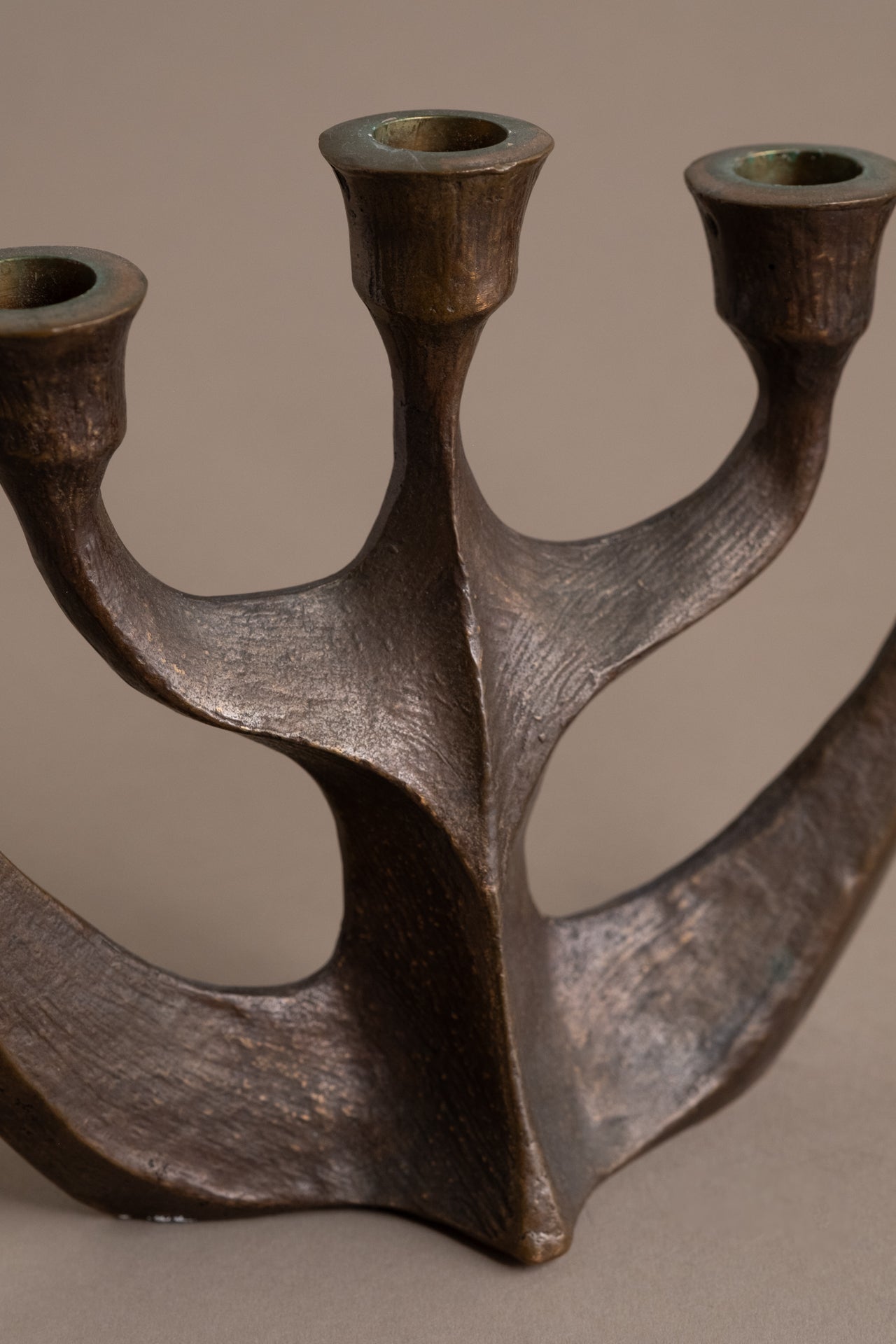 Detail of branching arms on Brutalist five-arm bronze candleholder, Germany, 1960s–70s.