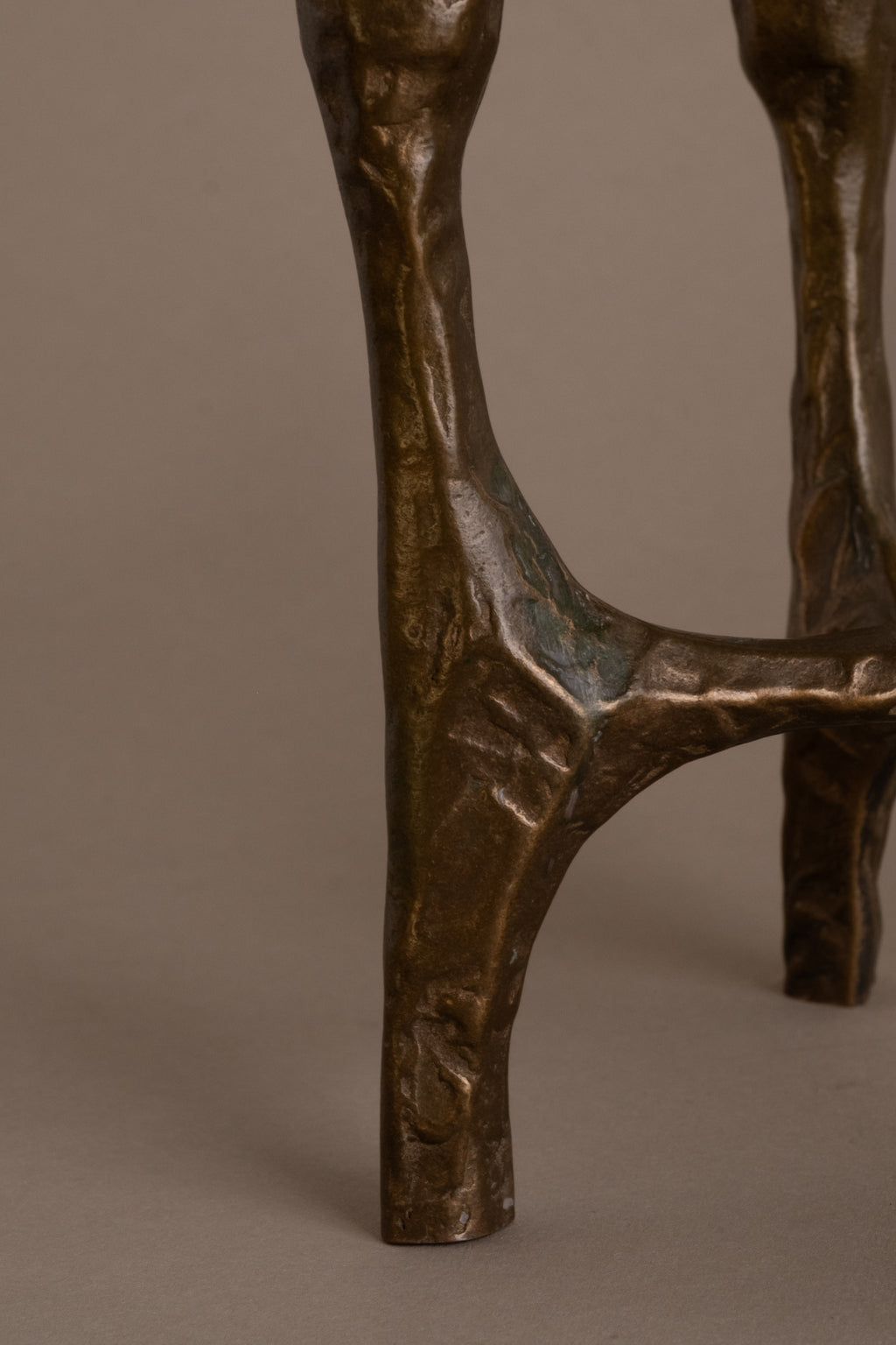 Detail of textured bronze surface and patina on Brutalist four-arm candleholder, 1970s Germany.