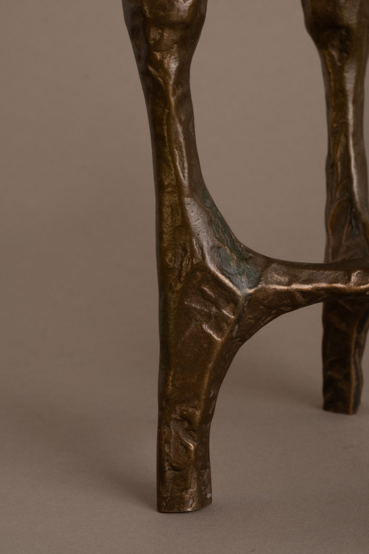 Detail of textured bronze surface and patina on Brutalist four-arm candleholder, 1970s Germany.