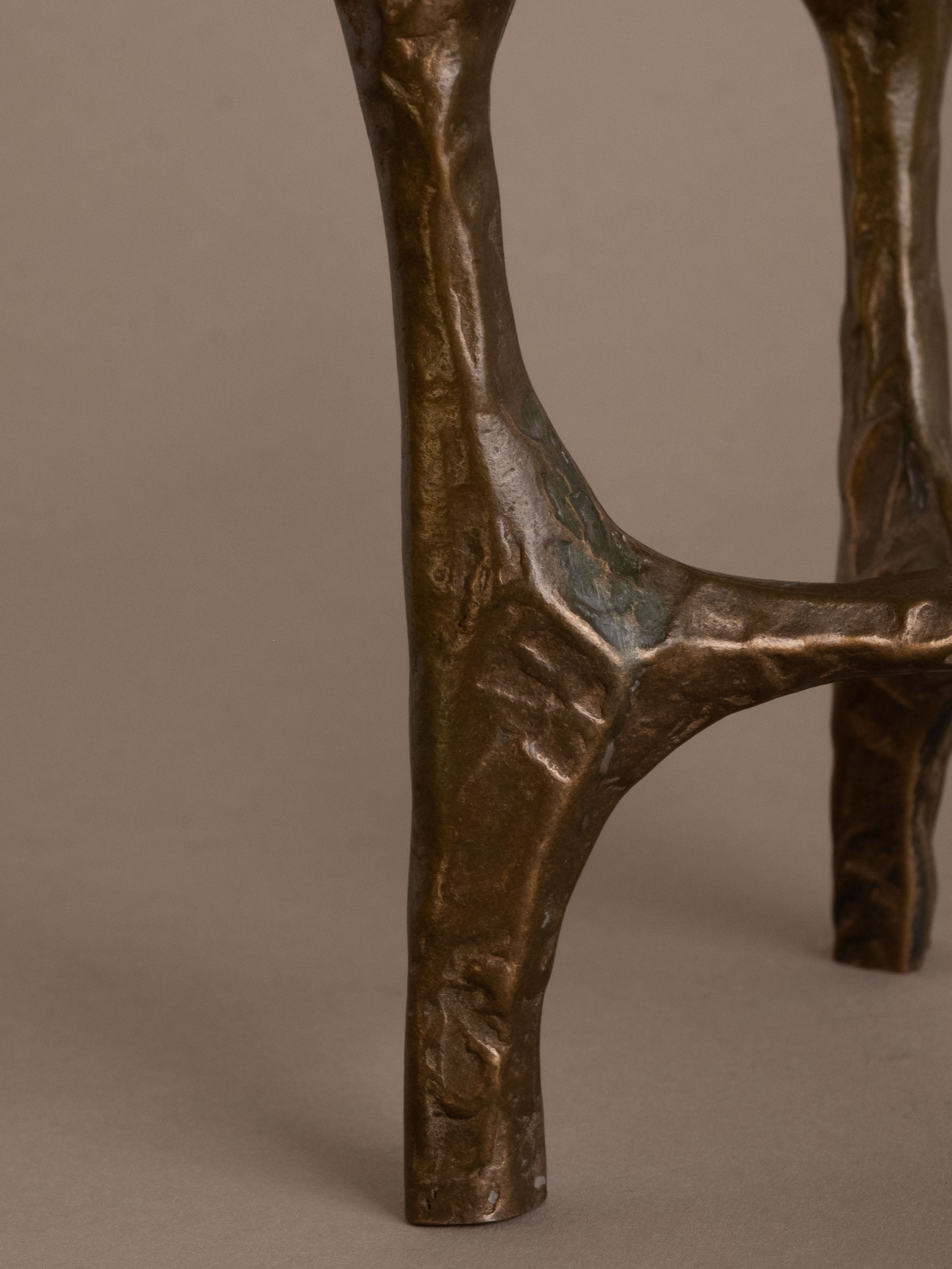 Detail of textured bronze surface and patina on Brutalist four-arm candleholder, 1970s Germany.