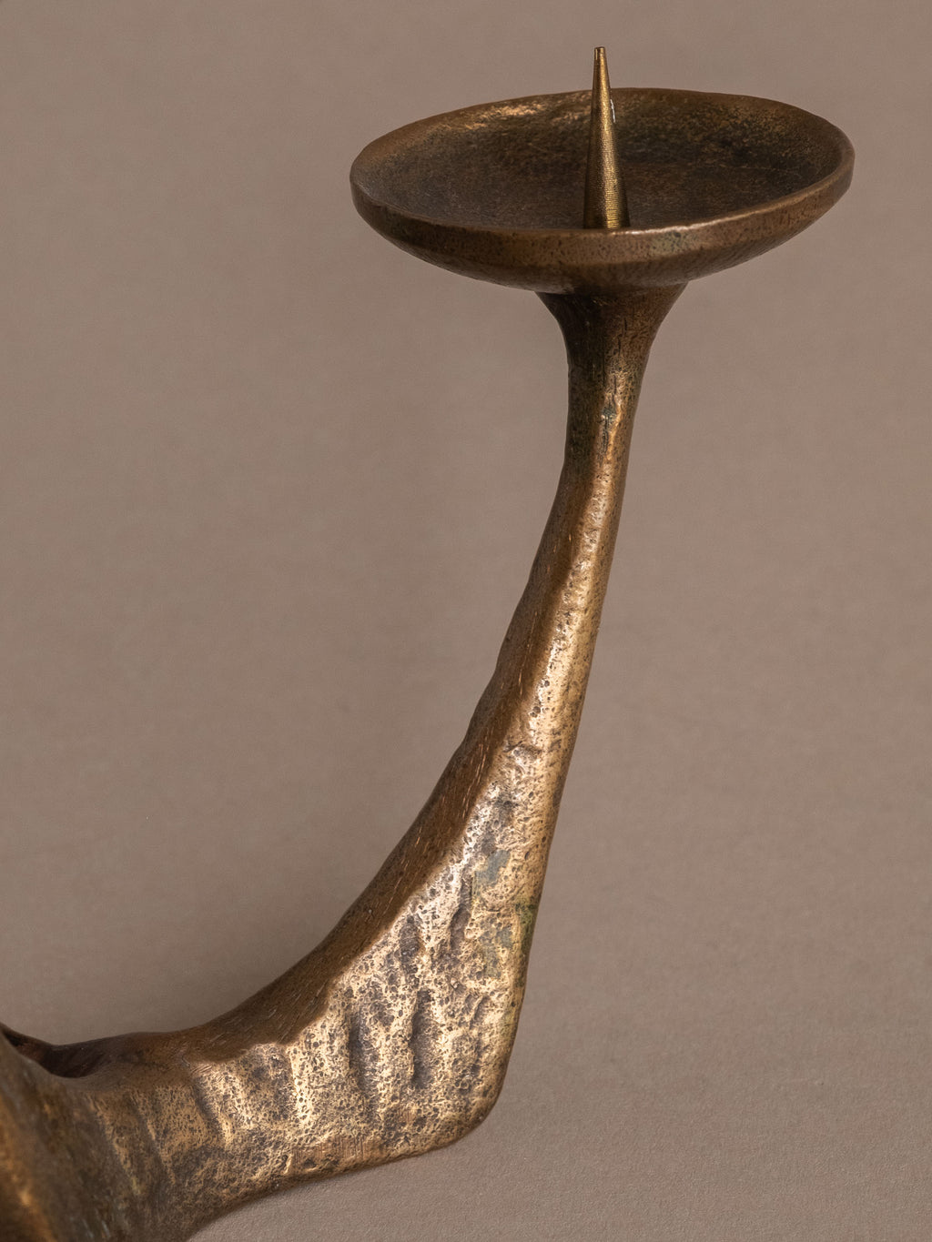Three-arm German Brutalist bronze candleholder with branching form and warm aged patina.