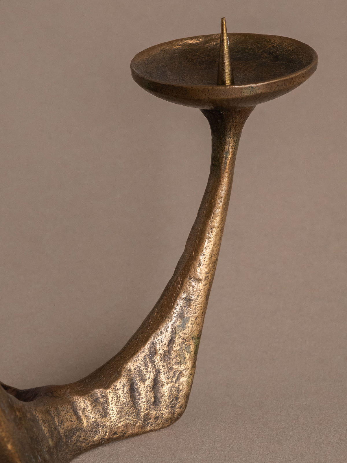 Three-arm German Brutalist bronze candleholder with branching form and warm aged patina.
