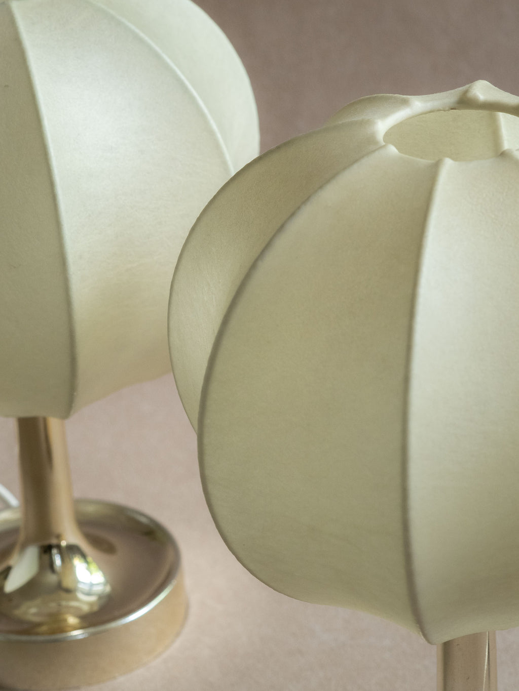 Top angled view of two Goldkant Salbo cocoon table lamps showing the open shade rims and ribbed cocoon structure.
