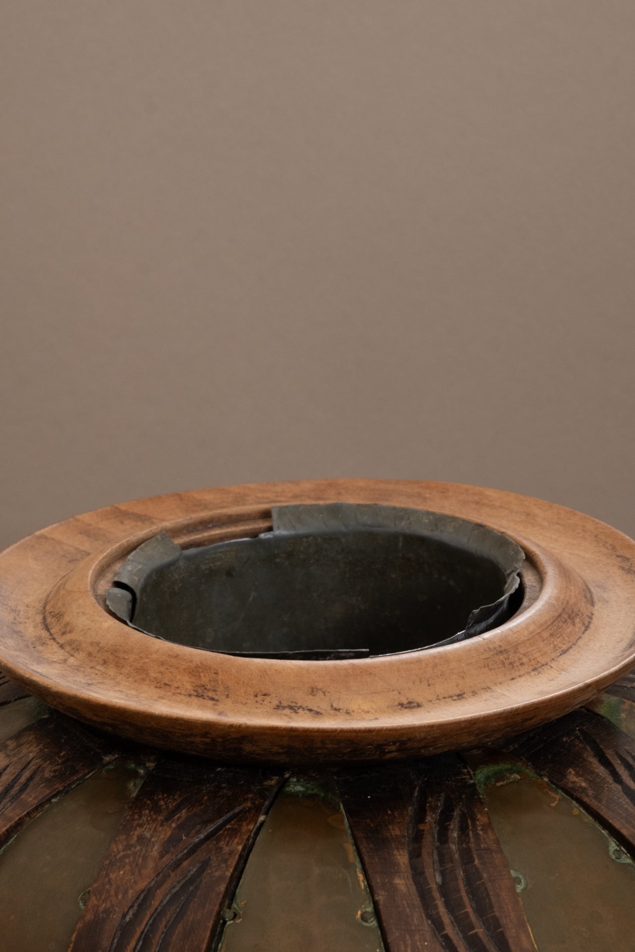 Interior view of attributed Gustave Serrurier-Bovy copper vase, showing removable metal liner and carved wooden rim, c. 1900 Belgium.