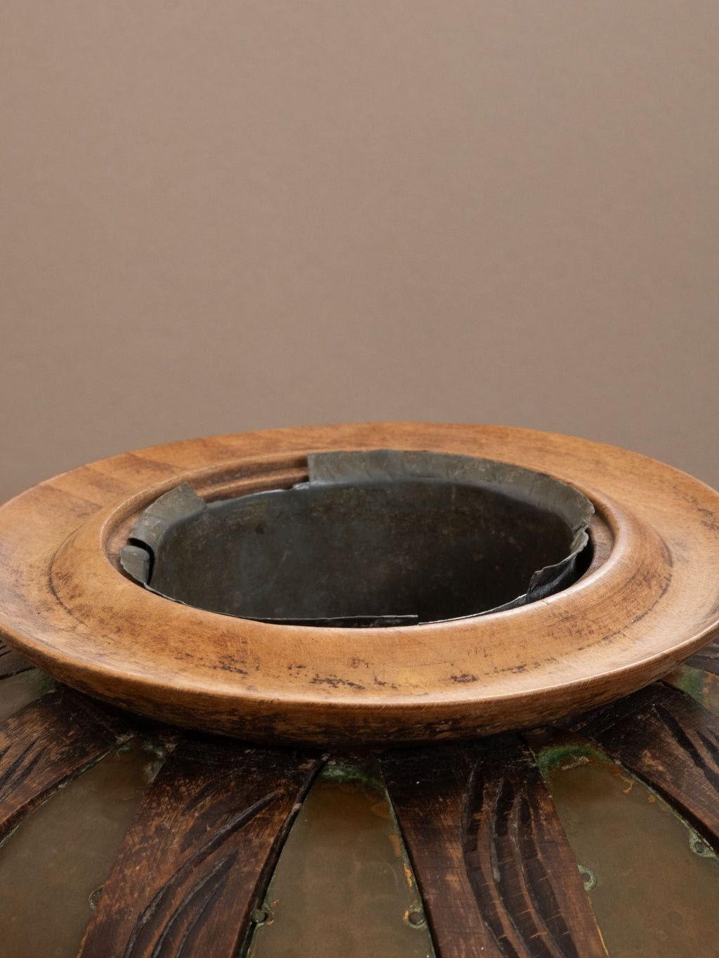 Interior view of attributed Gustave Serrurier-Bovy copper vase, showing removable metal liner and carved wooden rim, c. 1900 Belgium.