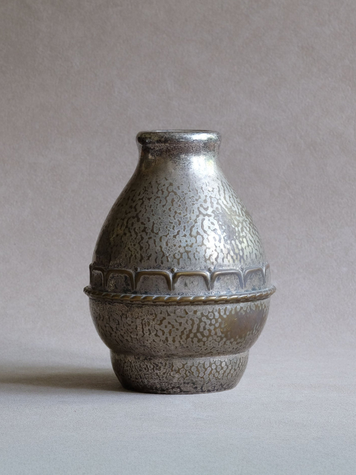 Art Deco HAGS silver-plated vase, Denmark, c. 1920s–30s, with hammered pear-shaped body, raised decorative band and mottled wear.