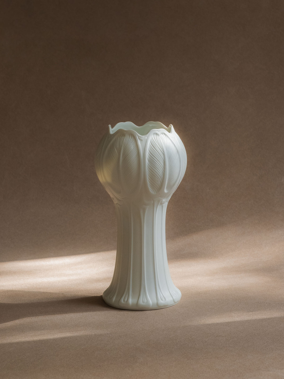 Full view of the 1973 Hutschenreuther Blattrelief vase by Hans Achtziger, showing its tall tulip-like silhouette and flared base.