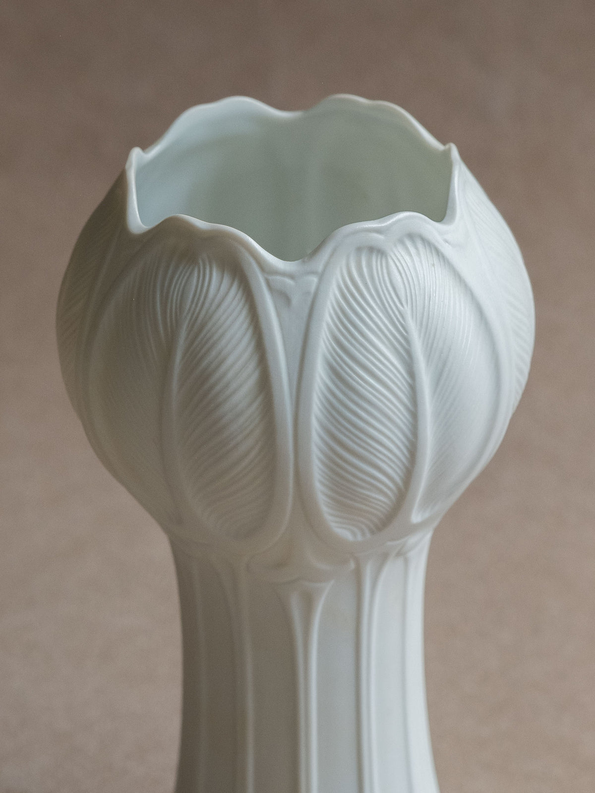 Close view of the Hutschenreuther Blattrelief vase showing the raised leaf relief around the flower-shaped upper body.