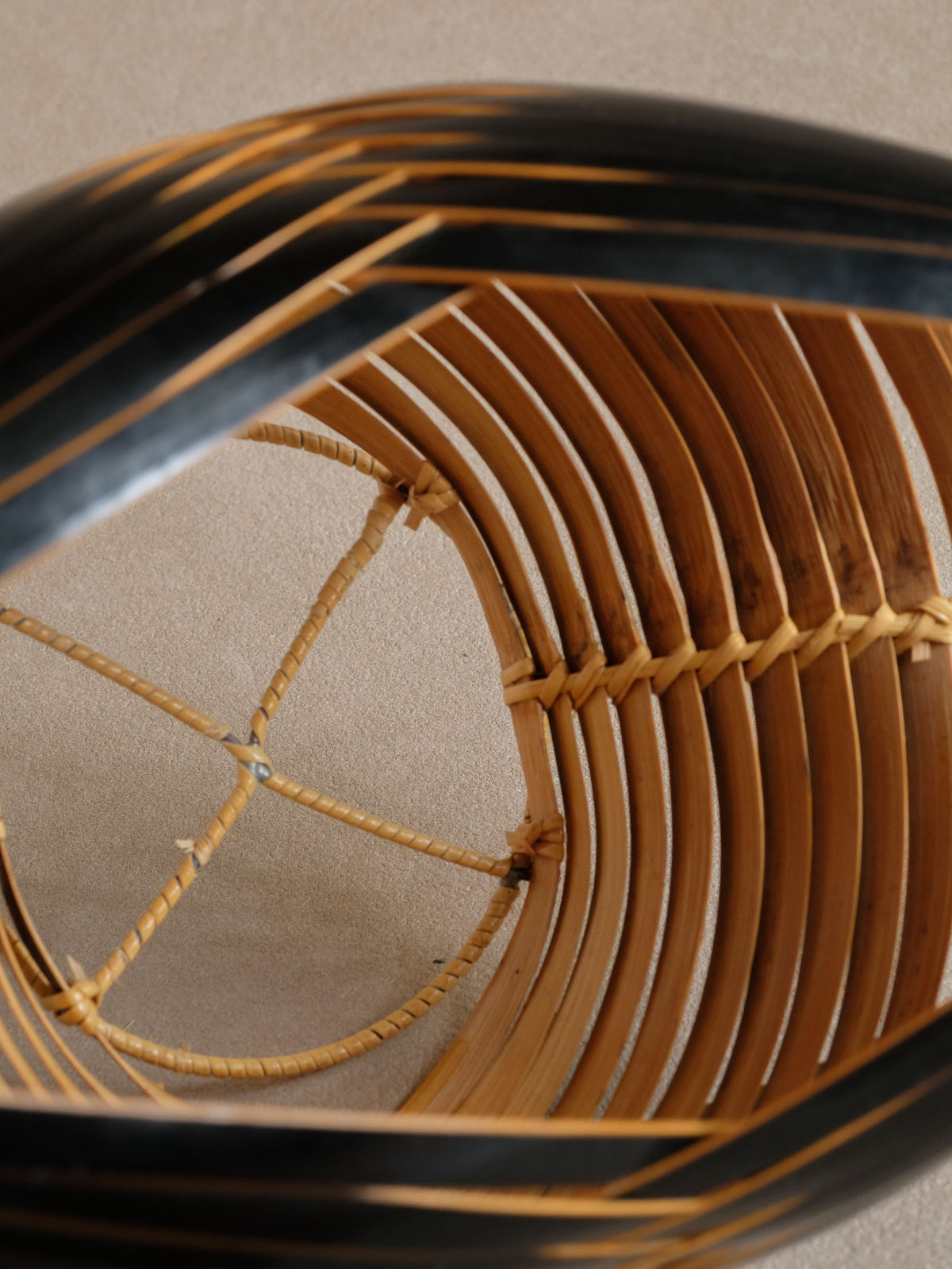 Close view of bamboo binding inside the openwork basket.