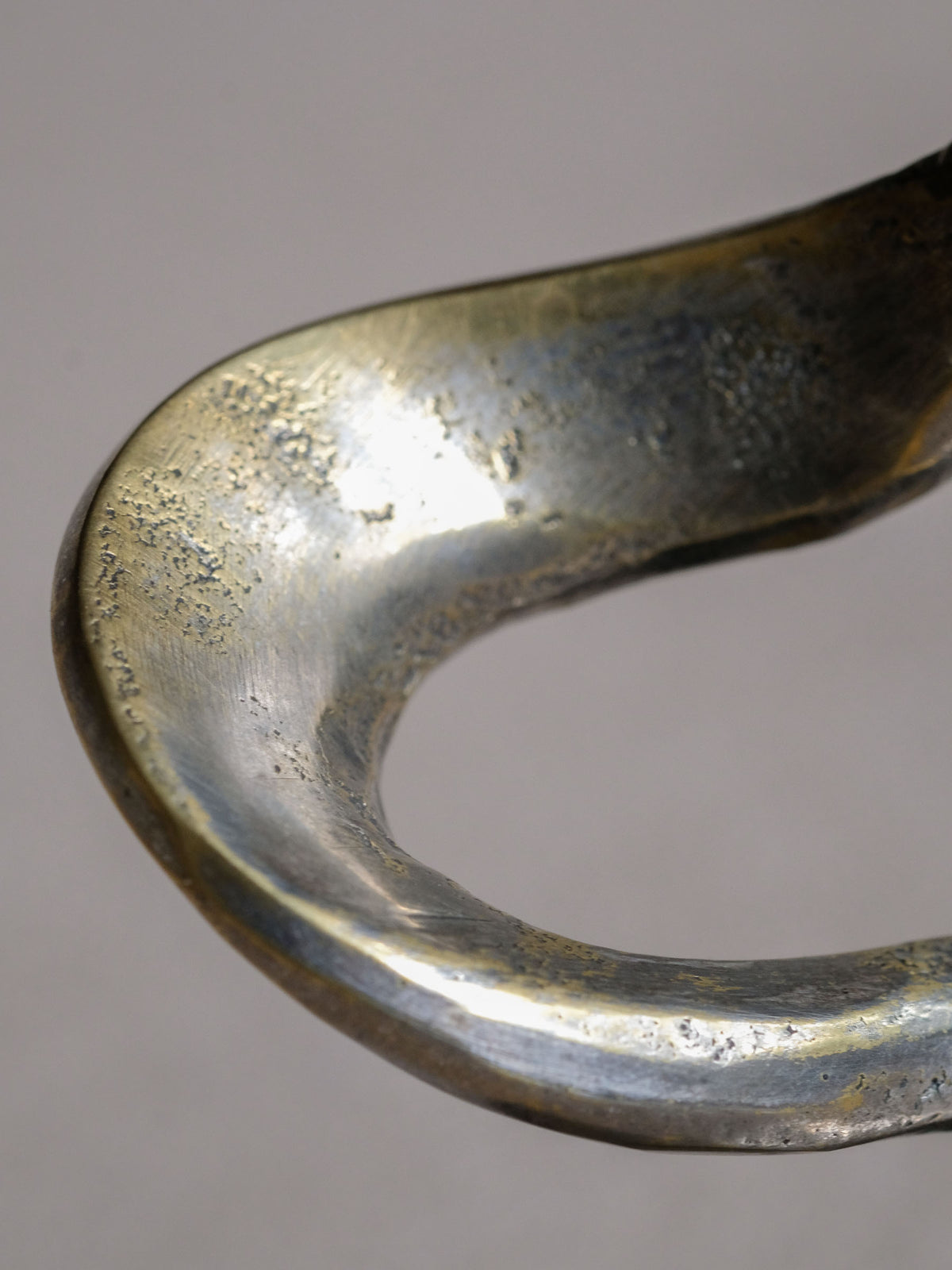 Angled view of the Kurt Jesch sculptural candleholder highlighting the large oval negative space.