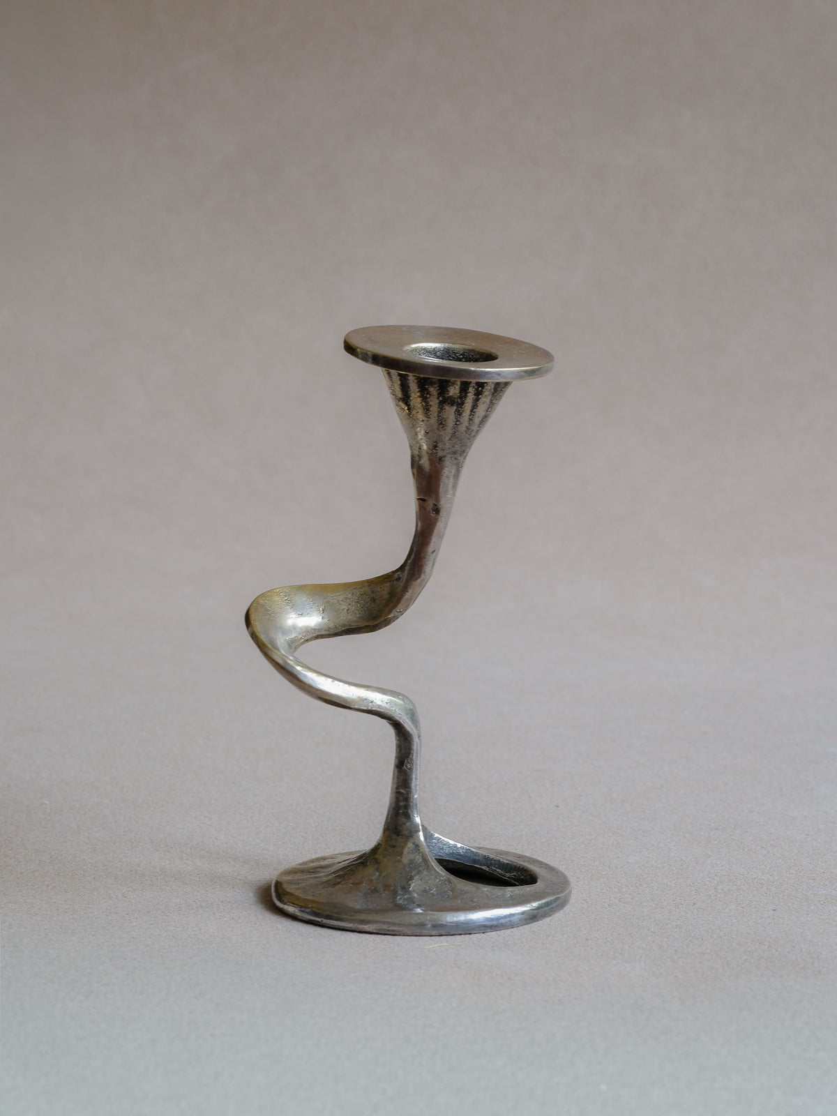 Alternate view of the Kurt Jesch single-light candleholder and compact rounded base.