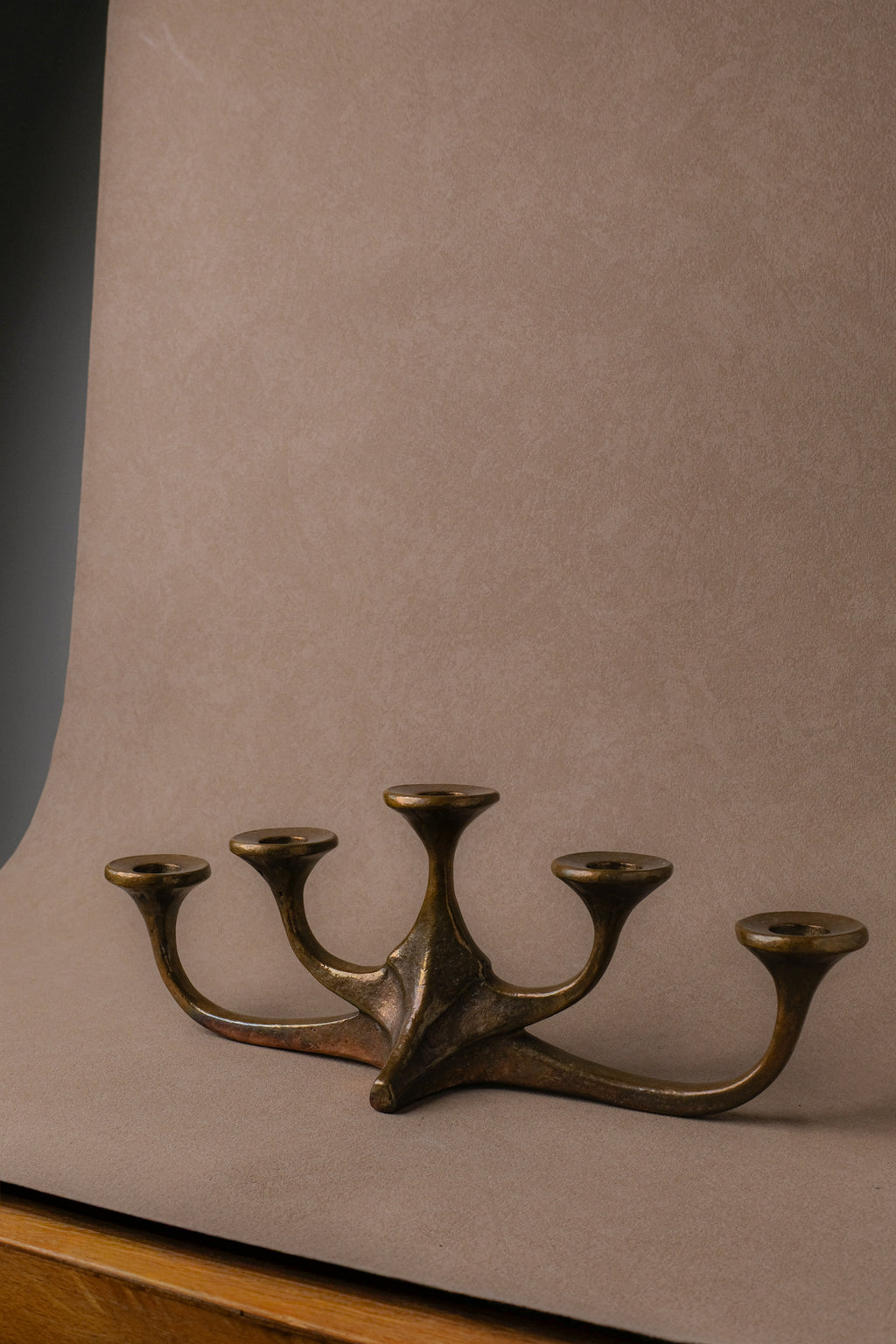 Five-arm cast bronze candleholder attributed to Michael Harjes, Germany, 1960s–70s.