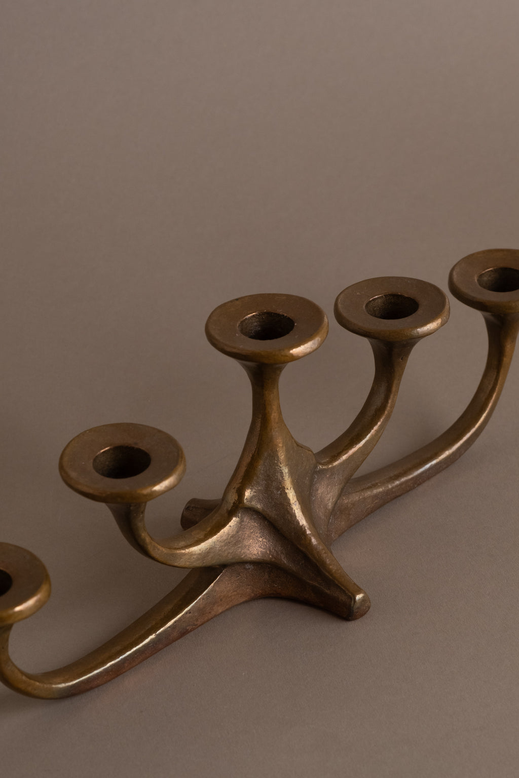 Angled view of mid-century bronze candleholder with five arms, Germany, 1960s–70s.