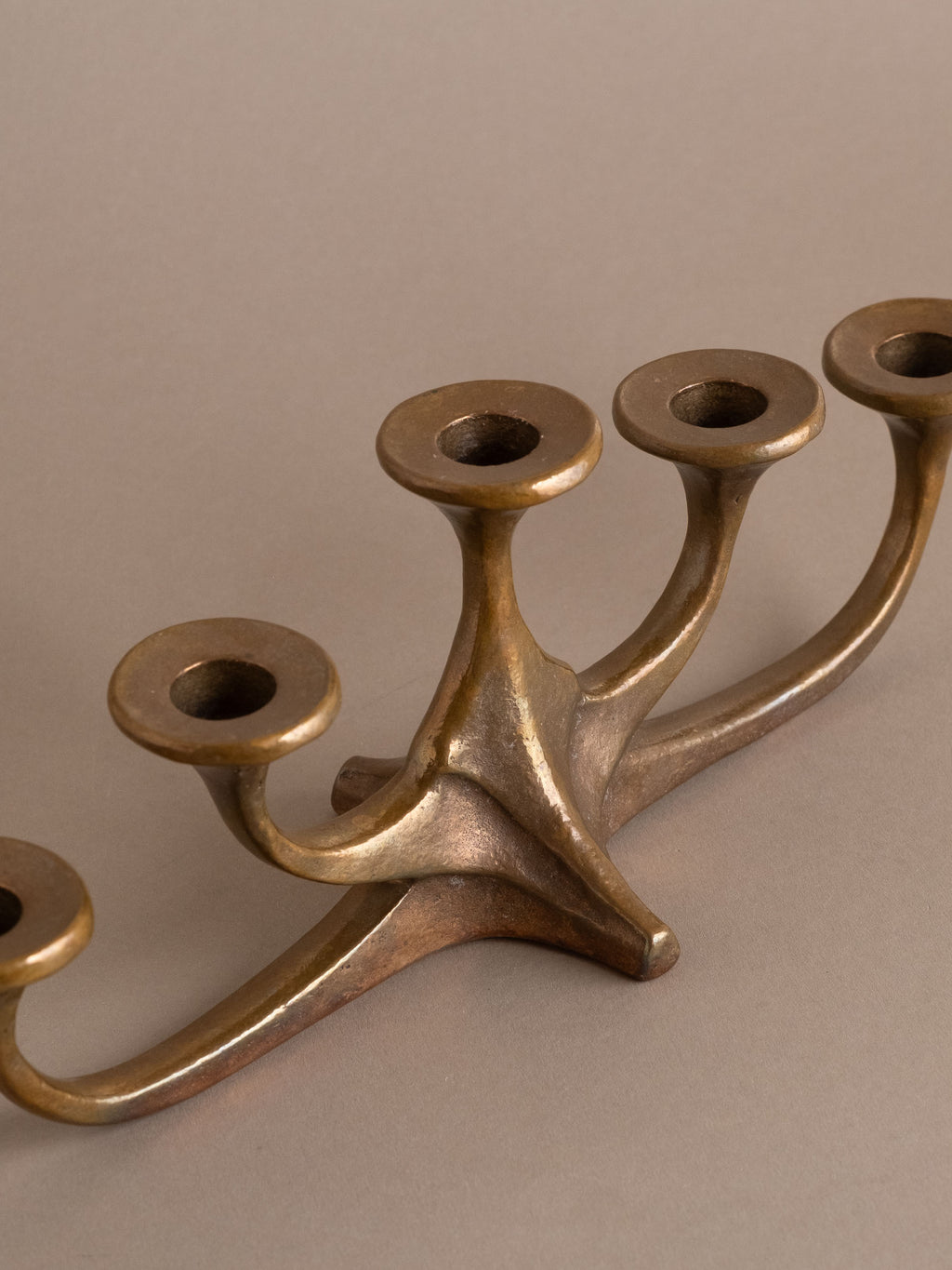 Angled view of mid-century bronze candleholder with five arms, Germany, 1960s–70s.