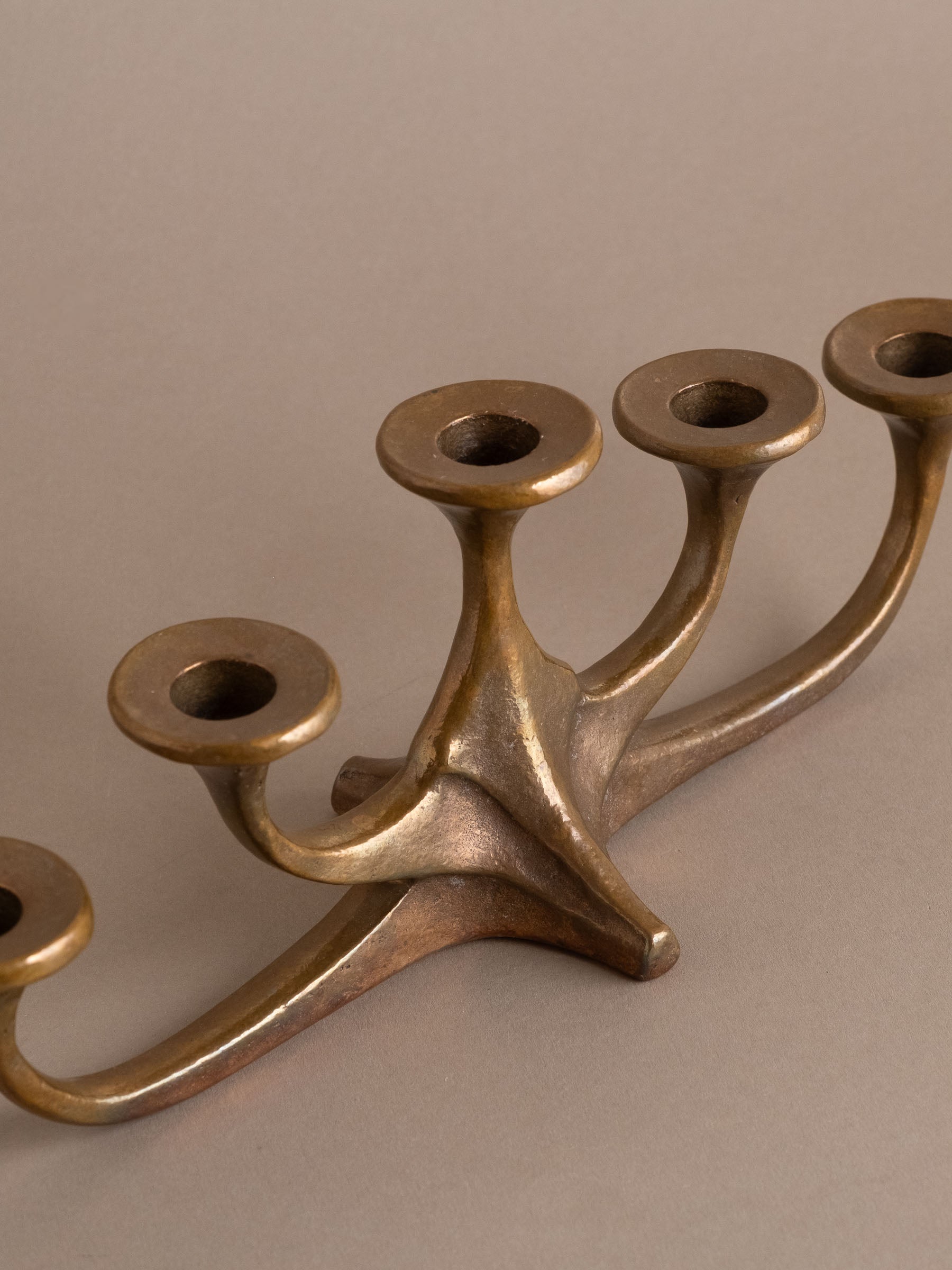 Angled view of mid-century bronze candleholder with five arms, Germany, 1960s–70s.