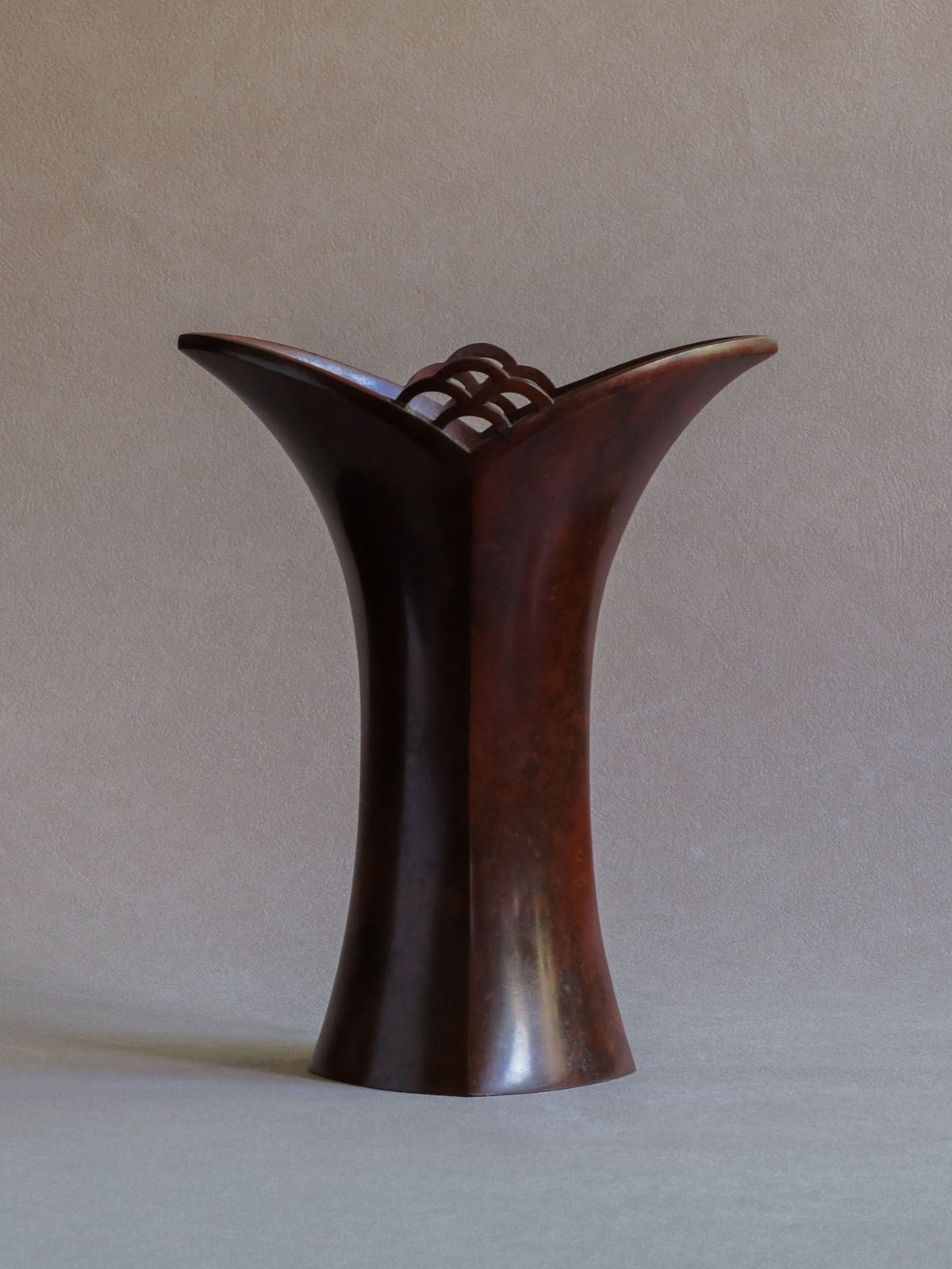 Nakajima Yasumi II bronze vase, full front view showing tall flared silhouette and purple-red mottled surface.