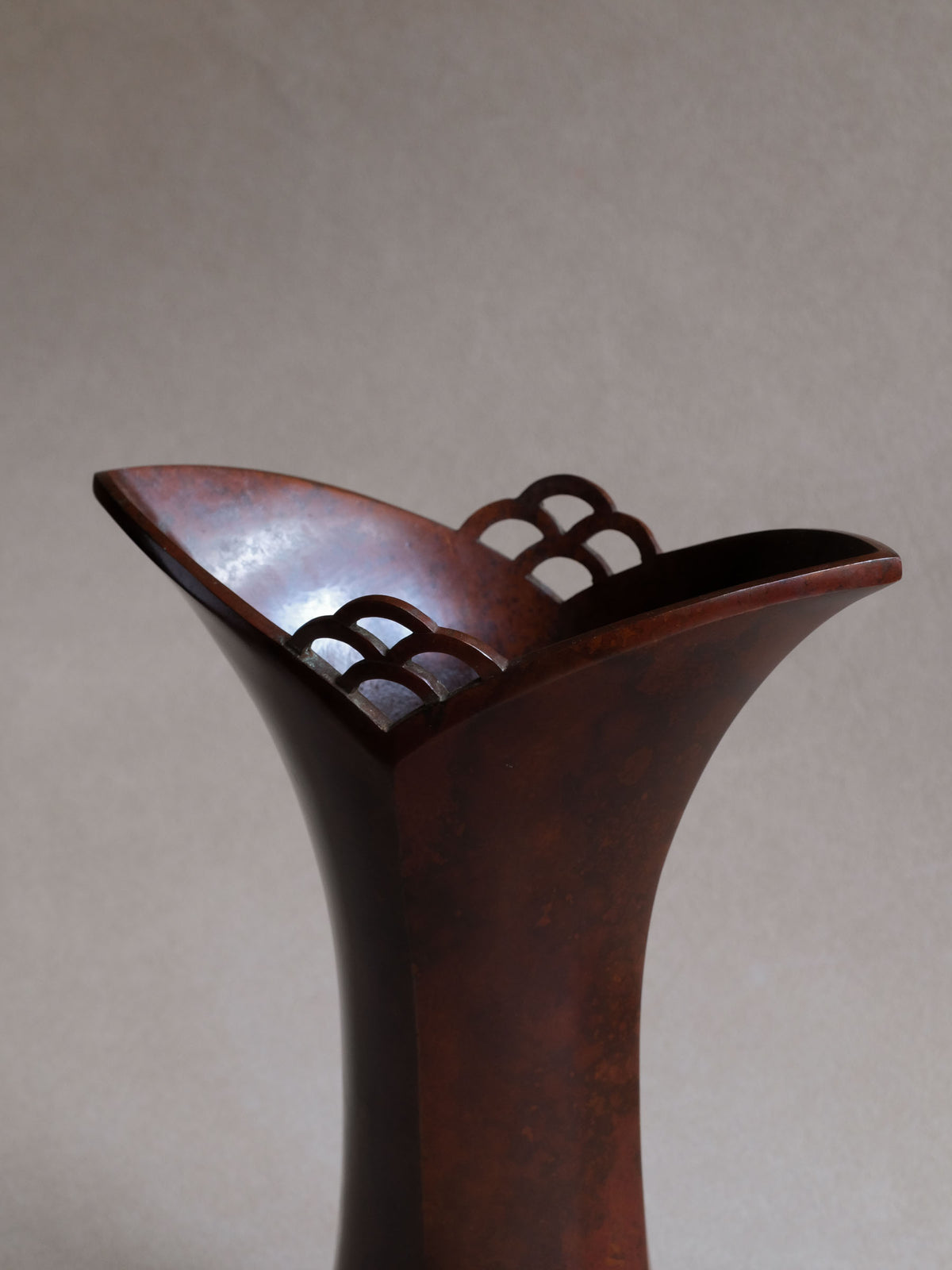 Three-quarter view of Nakajima Yasumi II 1961 vase showing asymmetric flared rim and openwork detail.