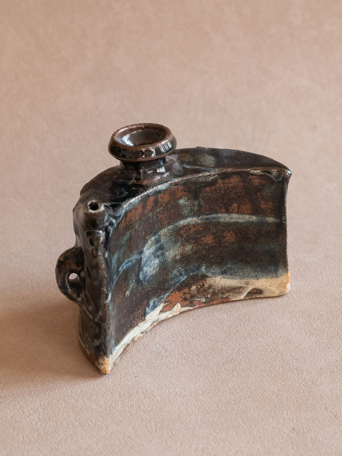 Close view of the filling opening, pouring spout and lug details on the Okinawan dachibin awamori flask.