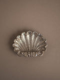 Small silver-plated shell ashtray, likely English and dating to c. 1950s–1970s, with scallop form, ribbed detail, and footed base.