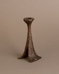 Angled view of Horst Dalbeck bronze candleholder, single-stem form, Germany, 1960s.
