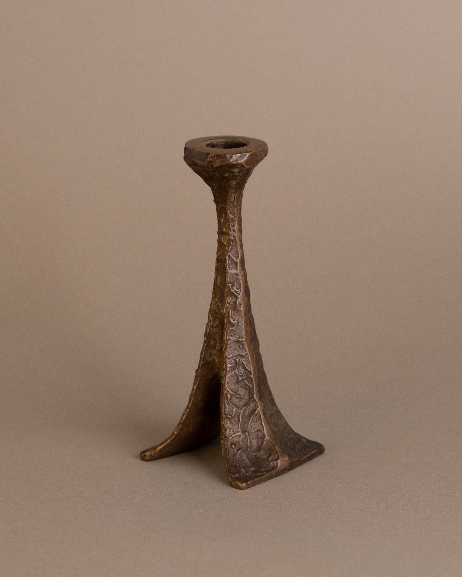 Angled view of Horst Dalbeck bronze candleholder, single-stem form, Germany, 1960s.