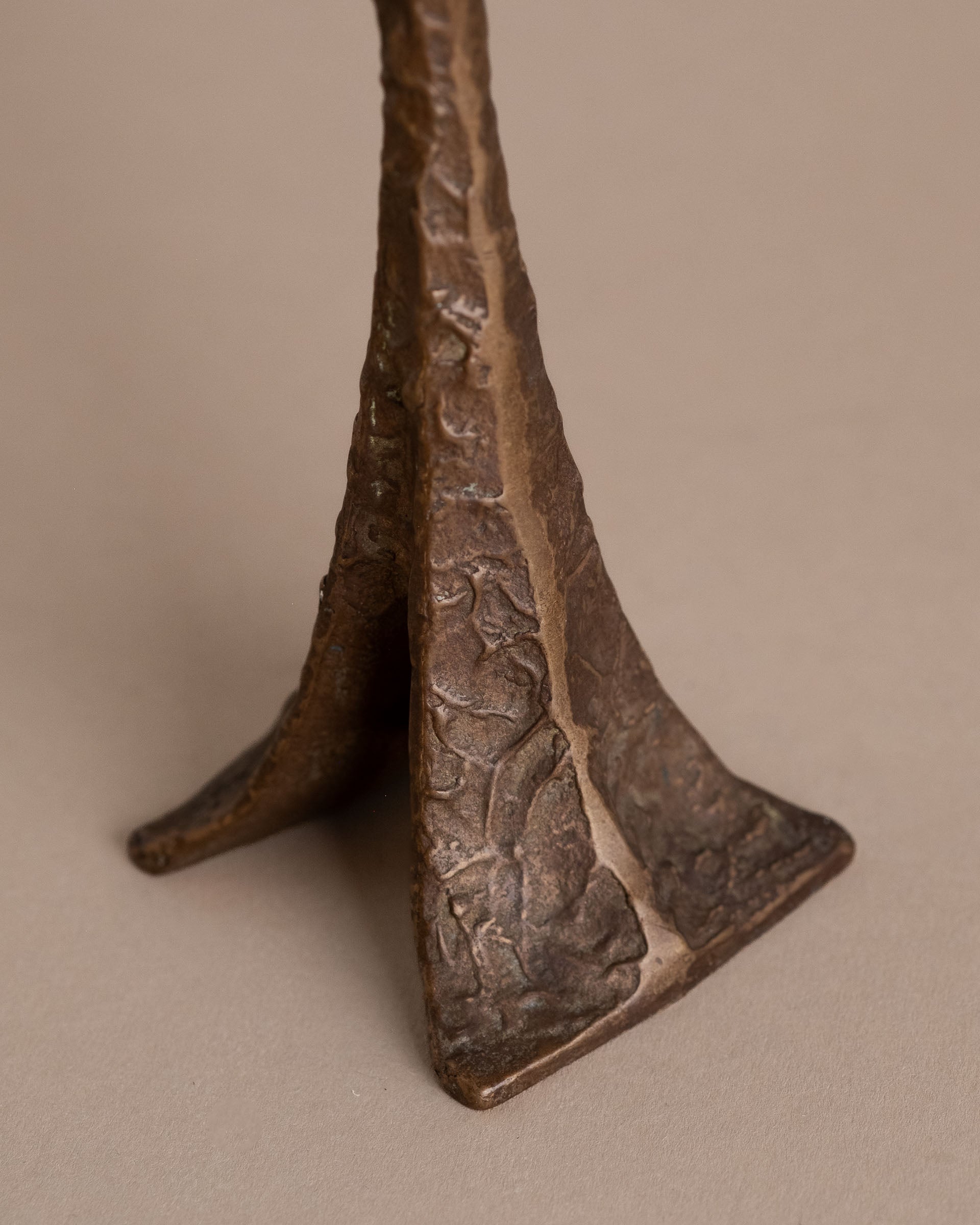 Textured cast bronze base of Horst Dalbeck single-stem candleholder, Germany, 1960s.