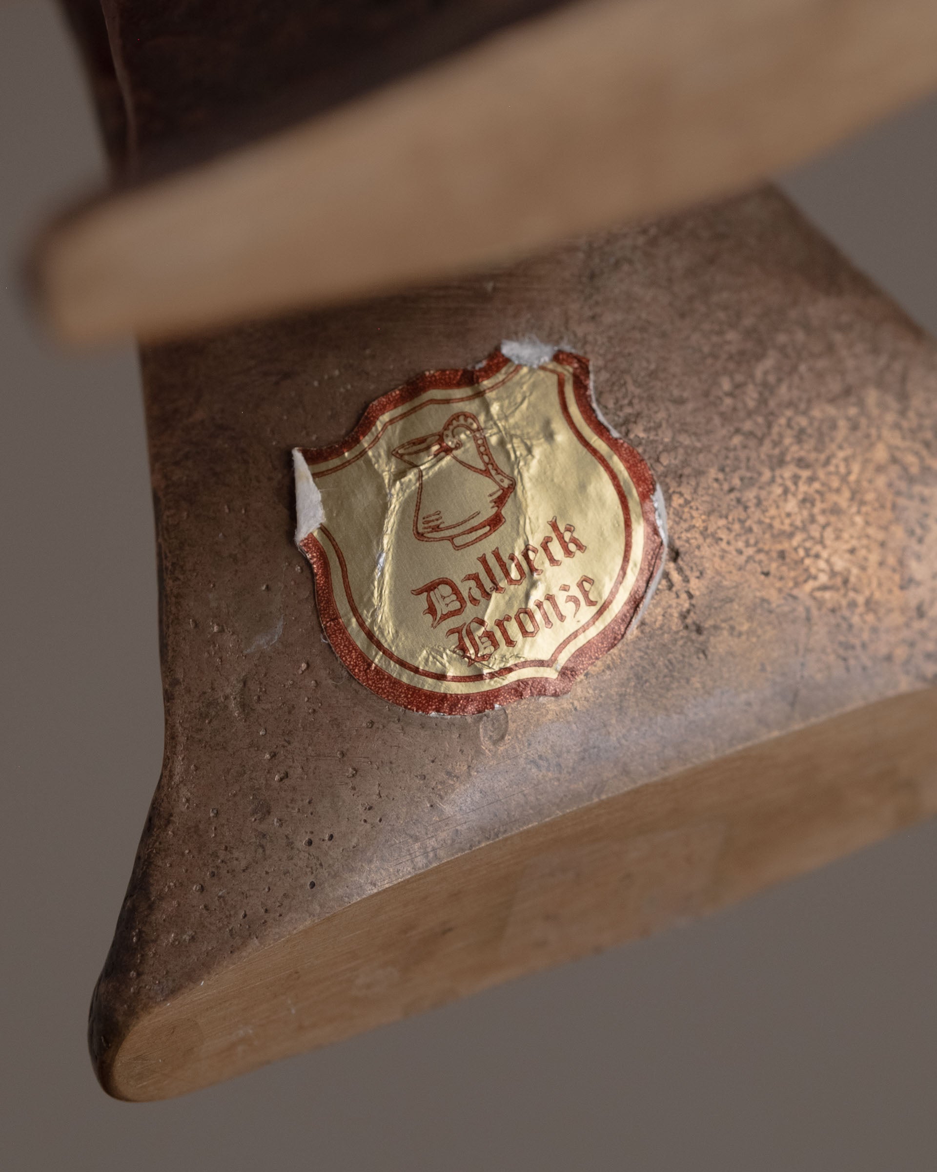 Original Dalbeck Bronze maker label on single-stem bronze candleholder, Germany, 1960s.