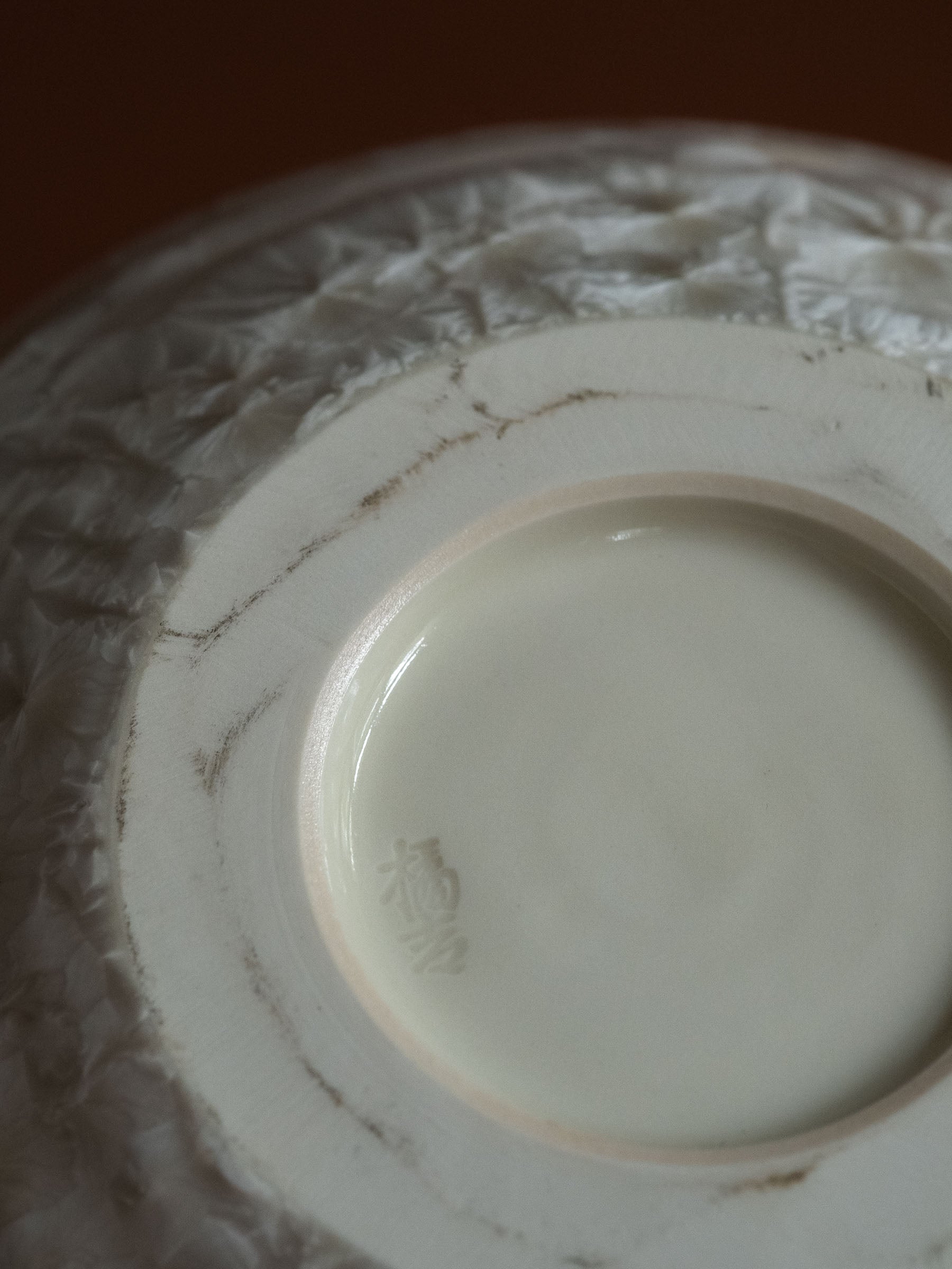 Underside of the Tachikichi crystalline glaze vase showing the recessed foot and age-related marks to the base.